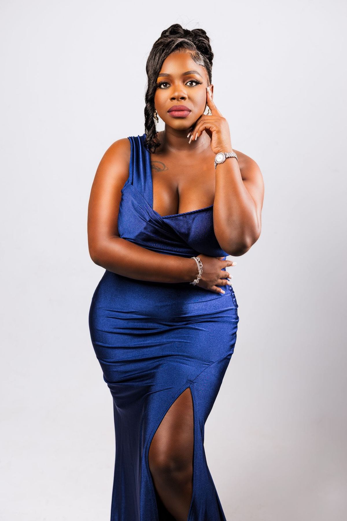 Studio portrait of Mama D in a royal blue evening gown